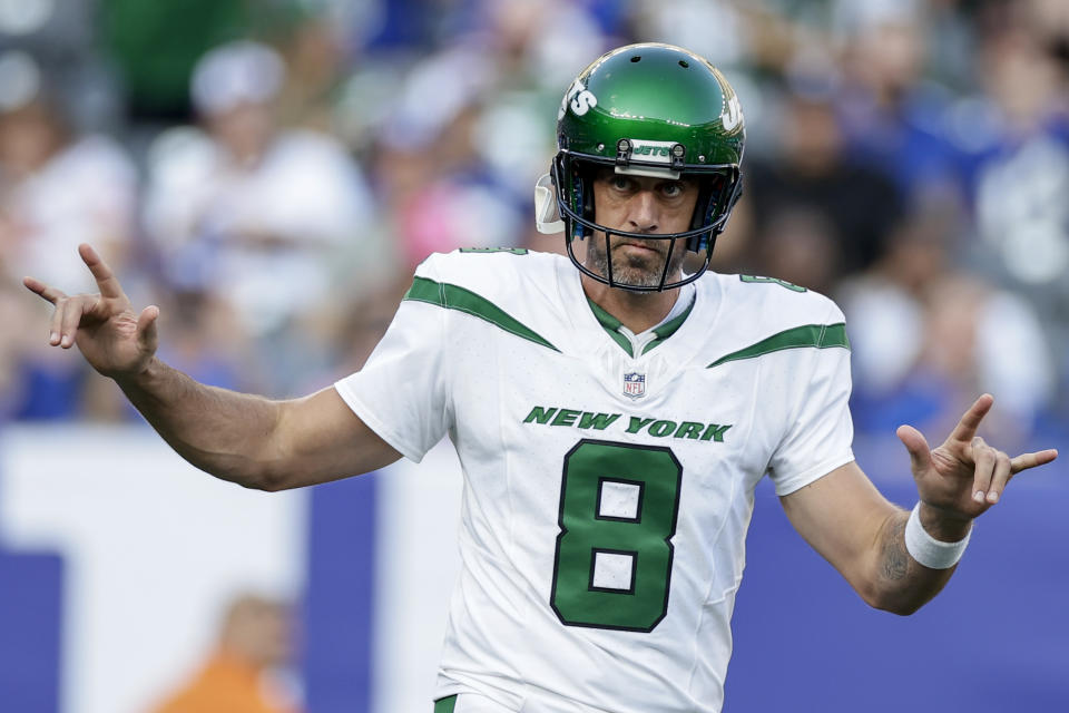 New York Jets quarterback Aaron Rodgers (8) sets up for a play during the first half of an NFL preseason football game against the New York Giants, Saturday, Aug. 26, 2023, in East Rutherford, N.J. (AP Photo/Adam Hunger)