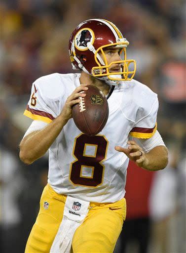 Washington Redskins quarterback Kirk Cousins looks for a receiver in the first half of a preseason NFL football game against the Baltimore Ravens, Saturday, Aug. 29, 2015, in Baltimore. (AP Photo/Nick Wass)