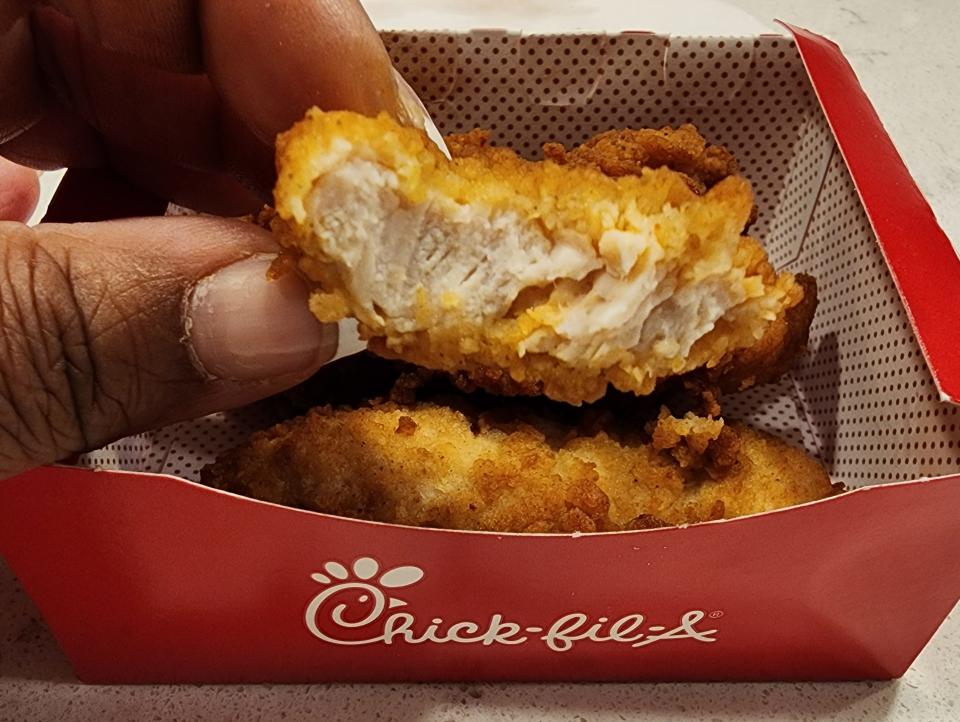 Chick-fil-A chicken strip with a bite taken out of it