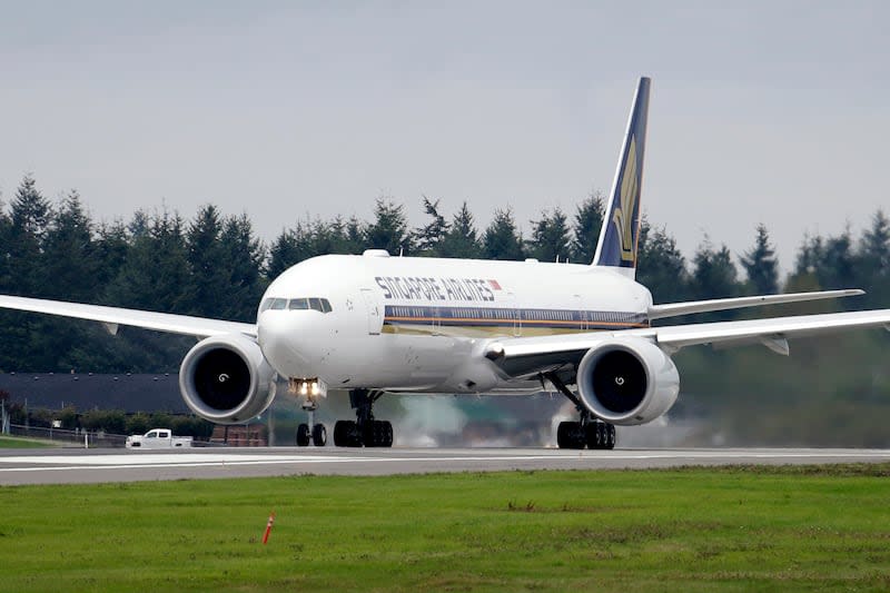 A Singapore Airlines Boeing 777-312ER readies to take off from Paine Field Tuesday, Sept. 17, 2013, in Everett, Wash. Singapore Airlines said on Tuesday, May 21, 2024, a person died aboard and others were injured when a London-Singapore flight encountered severe turbulence. | Elaine Thompson