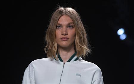 A model presents a creation from the Lacoste Spring/Summer 2014 collection during New York Fashion Week September 7, 2013. REUTERS/Eric Thayer