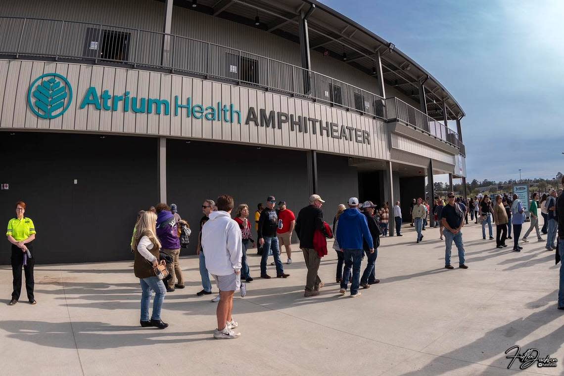 Concert-goers file into the new Atrium Health Amphitheater for its opening night on Sunday.