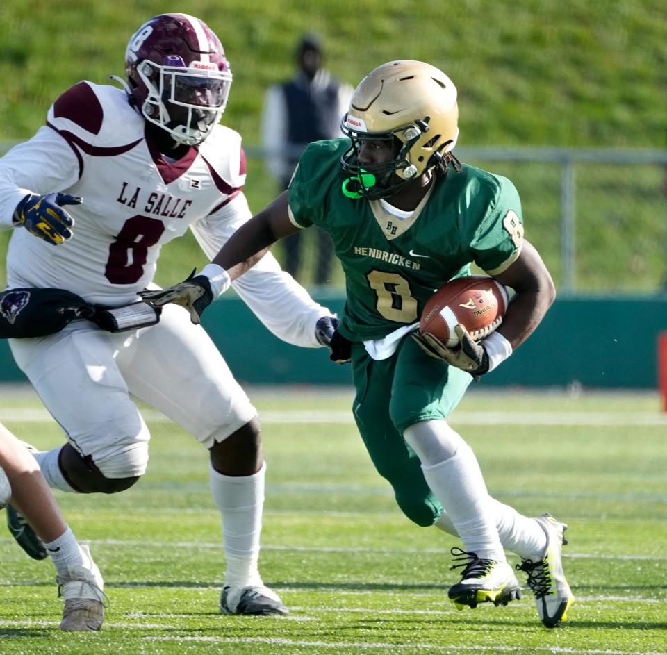 Hendricken's Oscar Weah looking for room to run during a game last year against La Salle.