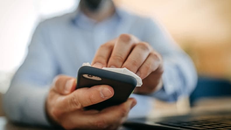 Good old-fashioned  warm, soapy water and an old toothbrush come in handy for cleaning your smartphone.