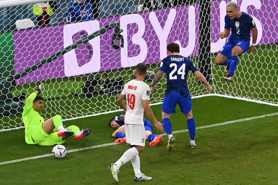 Christian Pulisic (center, on ground) was injured after scoring Team USA's goal against Iran in the World Cup on Nov. 29. (Odd Andersen / AFP - Getty Images)