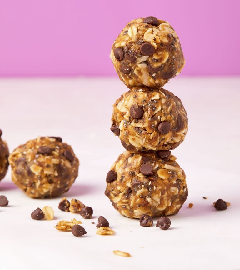 <p>When you need a little energy boost, these <a href="https://www.delish.com/cooking/g2145/peanut-butter-recipes/" rel="nofollow noopener" target="_blank" data-ylk="slk:peanut butter;elm:context_link;itc:0;sec:content-canvas" class="link ">peanut butter</a> bites will give you new life. We wanted these protein balls to taste a little bit like cookie dough (😈), so we added some mini dark chocolate chips. Skip them if you're trying to limit sugar.</p><p>Get the <strong><a href="https://www.delish.com/cooking/recipe-ideas/a25416301/protein-balls-recipe/" rel="nofollow noopener" target="_blank" data-ylk="slk:Peanut Butter Protein Balls recipe;elm:context_link;itc:0;sec:content-canvas" class="link ">Peanut Butter Protein Balls recipe</a></strong>.</p>