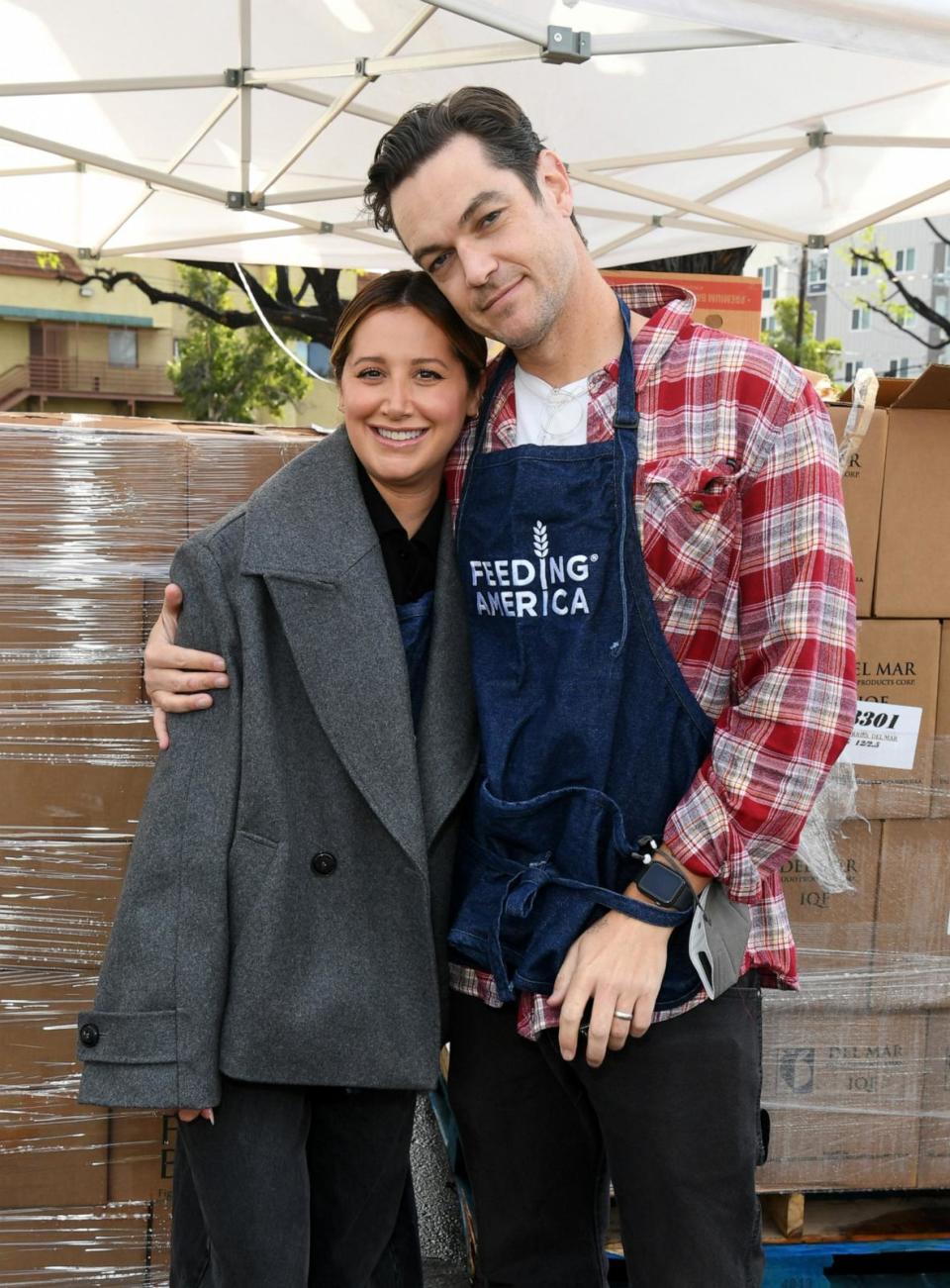 PHOTO: In this Dec. 22, 2023, file photo, Ashley Tisdale and Christopher French volunteer in North Hills, Calif. (Jon Kopaloff/Getty Images for Feeding America, FILE)