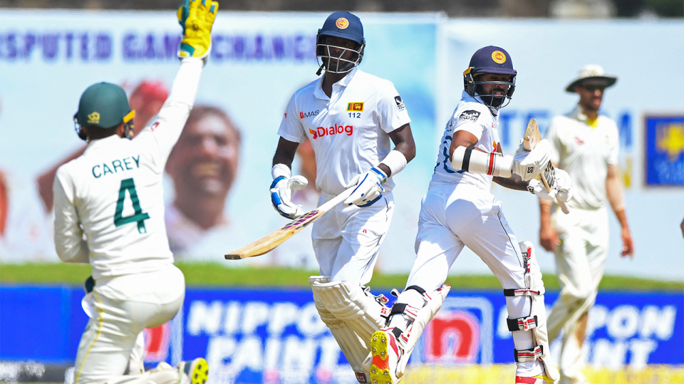 Cricket batter Angelo Matthews (pictured middle) running between the wicket against Australia.