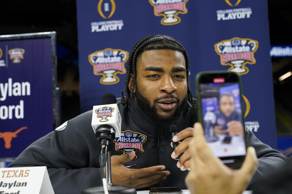 Texas linebacker Jaylan Ford talks to reporters during media day for the the upcoming Sugar Bowl NCAA CFP college football semi-final game game in New Orleans, Saturday, Dec. 30, 2023. (AP Photo/Gerald Herbert)