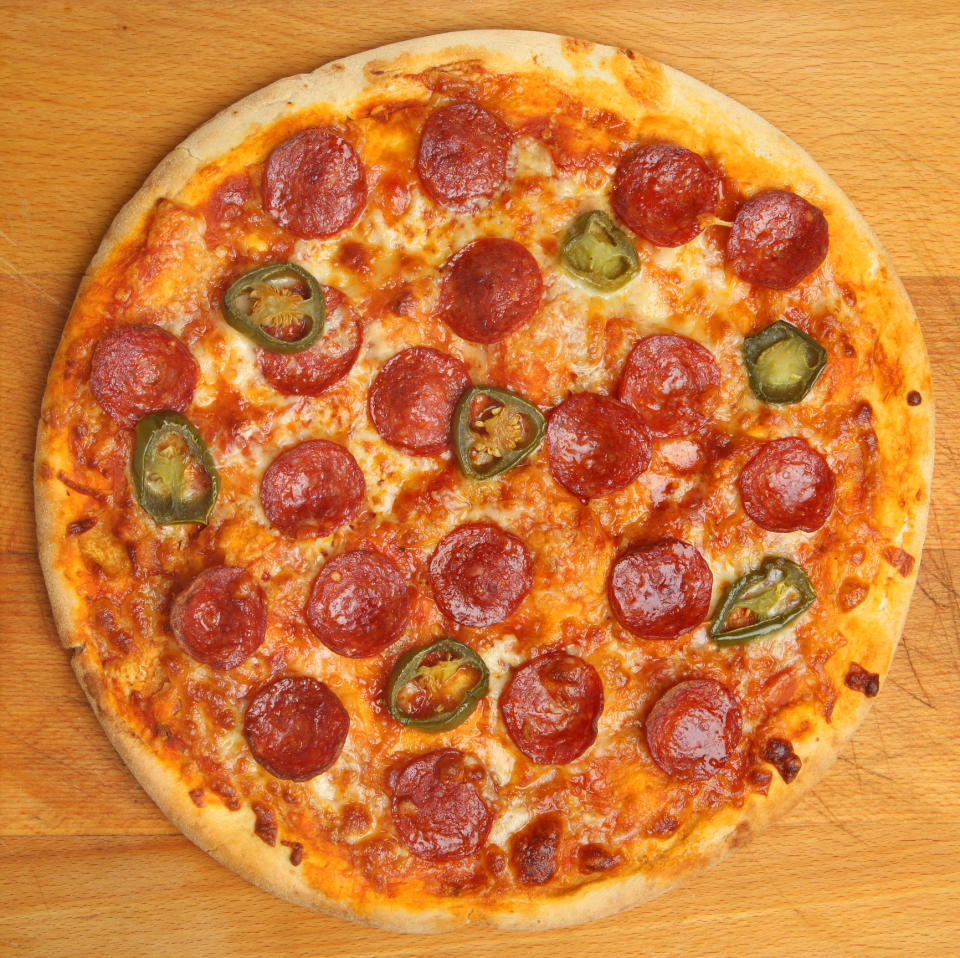 A pepperoni and jalapeno pizza