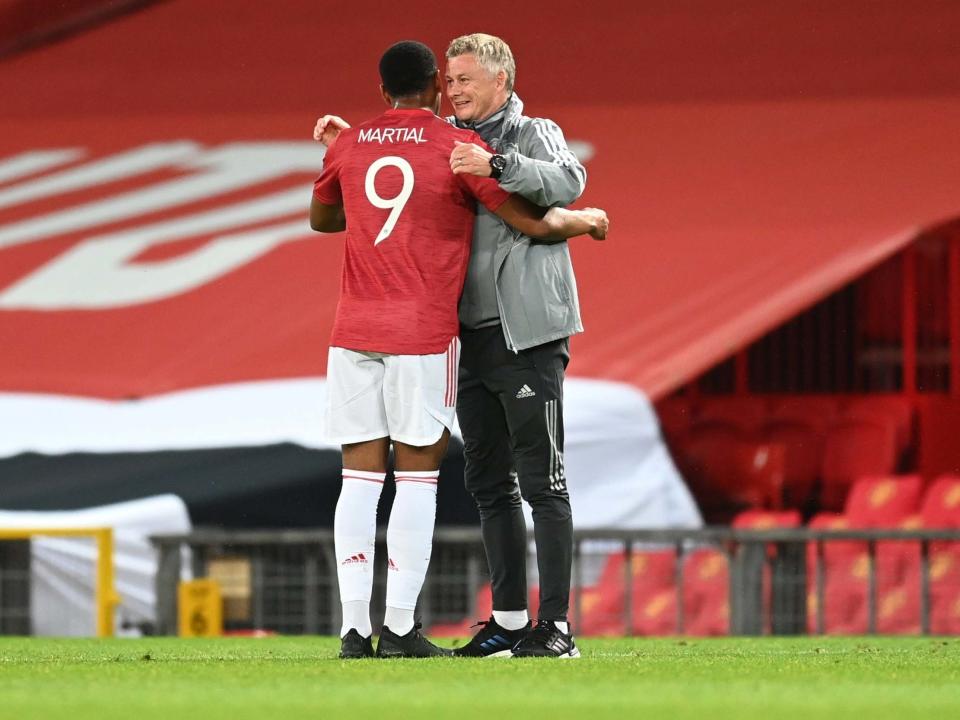 Anthony Martial and Ole Gunnar Solskjaer embrace at full-time: Getty Images