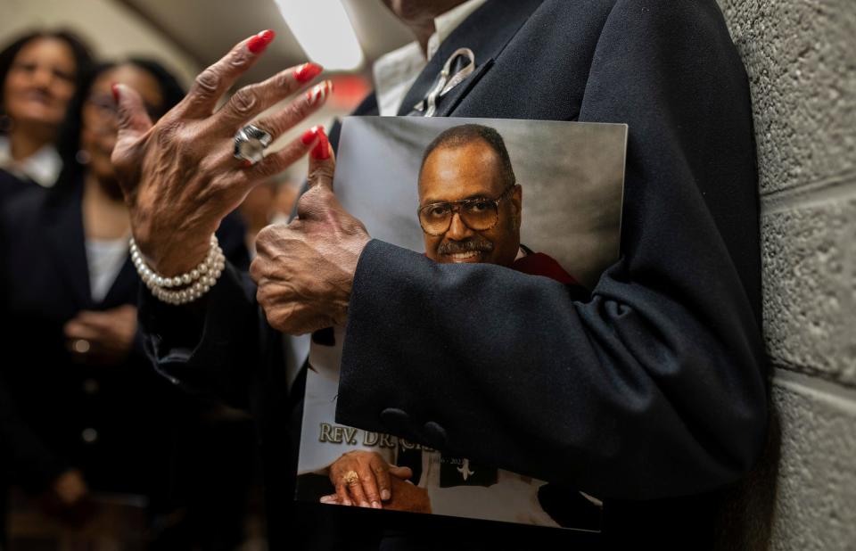 A woman holds a program for the funeral services of the Rev. Charles G. Adams inside the Hartford Memorial Baptist Church in Detroit on Friday, Dec. 15, 2023.