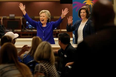 U.S. Democratic presidential nominee Hillary Clinton (L) and Nevada Democratic Senate candidate Catherine Cortez arrive to greet hotel workers at The Mirage in Las Vegas, Nevada, U.S. November 2, 2016. REUTERS/Brian Snyder