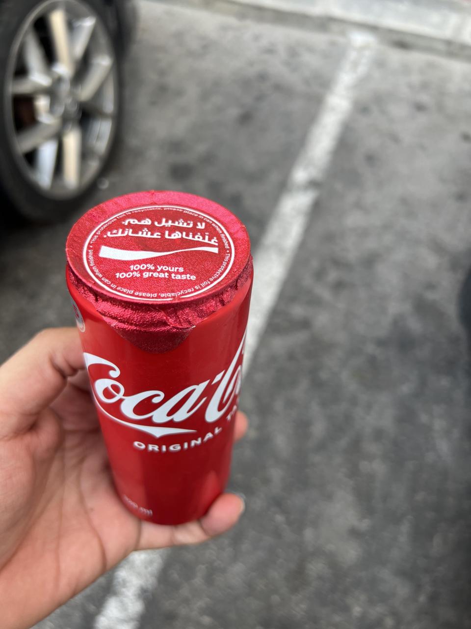 Instead of having an aluminum top with a pop tab, the whole top is covered with paper that needs to be pulled back