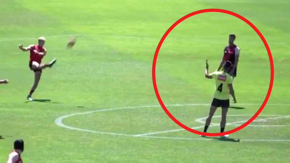 Darcy Parish (pictured left) kicking the ball and Kyle Langford (pictured right) moving off the mark and giving away a 50m penalty.