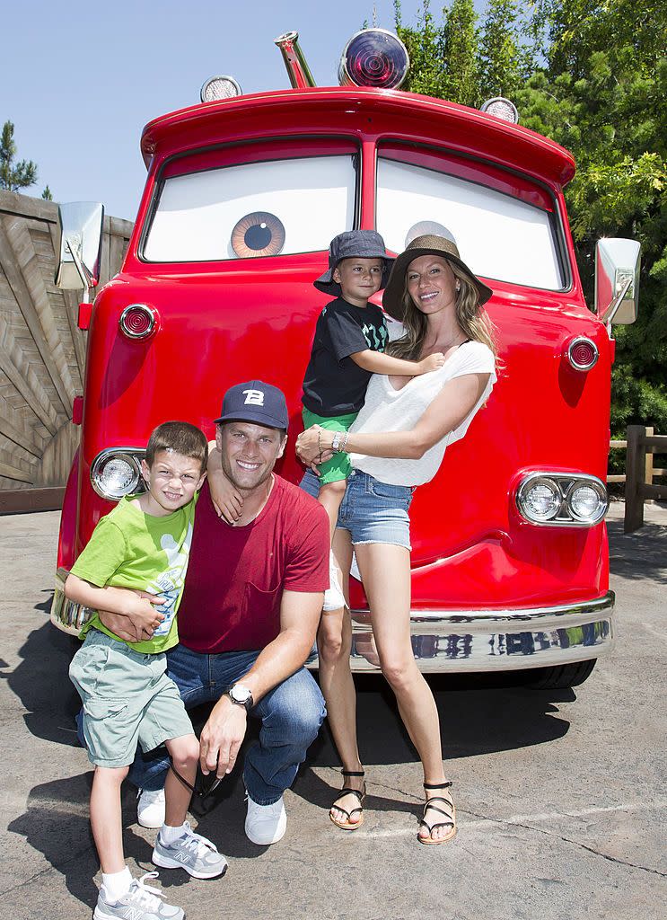 anaheim, ca july 02 in this handout photo provided by disney parks, tom brady, his son jack, 5, gisele bundchen, and their son benjamin, 3, pose with red the fire truck at cars land at disney california adventure park july 2, 2013 in anaheim, california the 12 acre cars land immerses guests in the thrilling world of the disney pixar blockbuster cars film franchise as they step into the town of radiator springs photo by paul hiffmeyerdisneyland resort via getty images