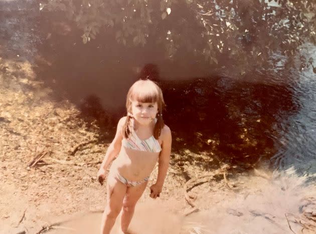 The author by a mountain creek on a camping trip, circa 1980.