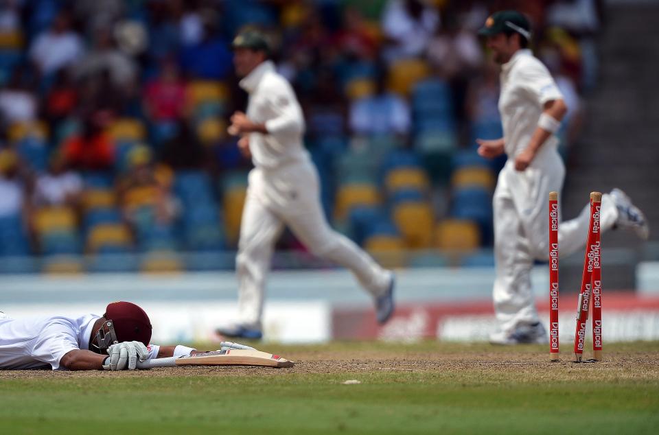 West Indies cricketer Carlton Baugh (L)