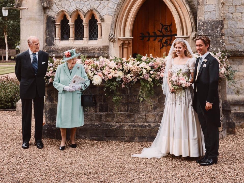 Princess Beatrice and Edoardo Mapelli Mozzi stand with Queen Elizabeth and Prince Philip in a socially-distanced wedding photo.
