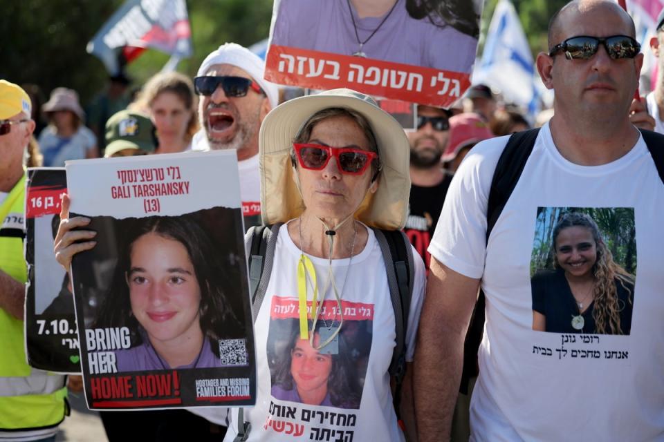 Family members, friends and supporters of the hostages held by Hamas in Gaza take part in a march from Tel Aviv (EPA)