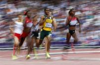 South Africa's Caster Semenya (C) runs with other competitors in her women's 800m semi-final during the London 2012 Olympic Games at the Olympic Stadium August 9, 2012.