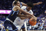 Kentucky's Daimion Collins, right, and Southern University's Isaiah Rollins (4) vie for the ball during the first half of an NCAA college basketball game in Lexington, Ky., Tuesday, Dec. 7, 2021. (AP Photo/James Crisp)