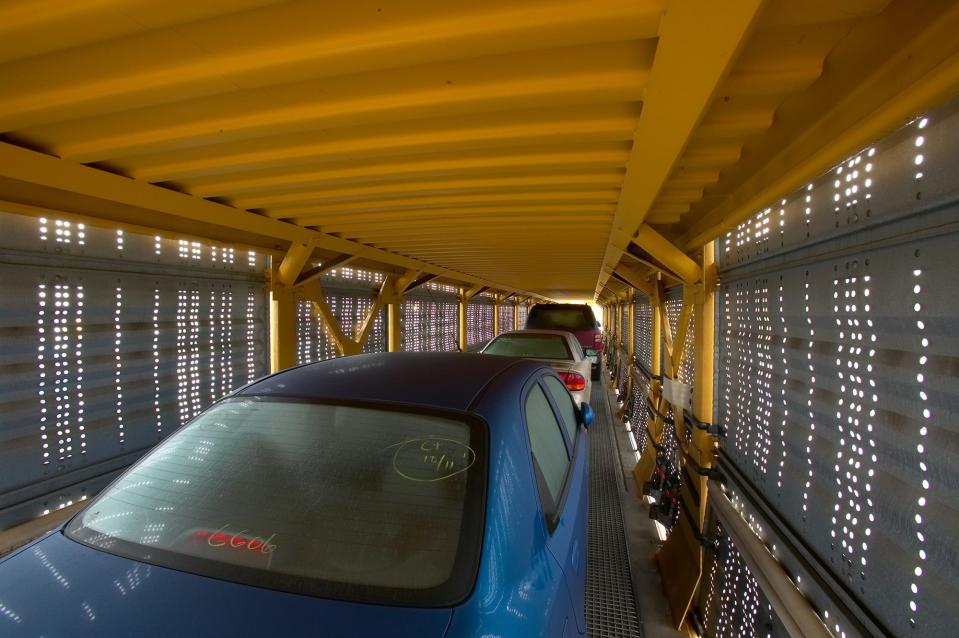 Loaded vehicles on Union Pacific autorack containers.