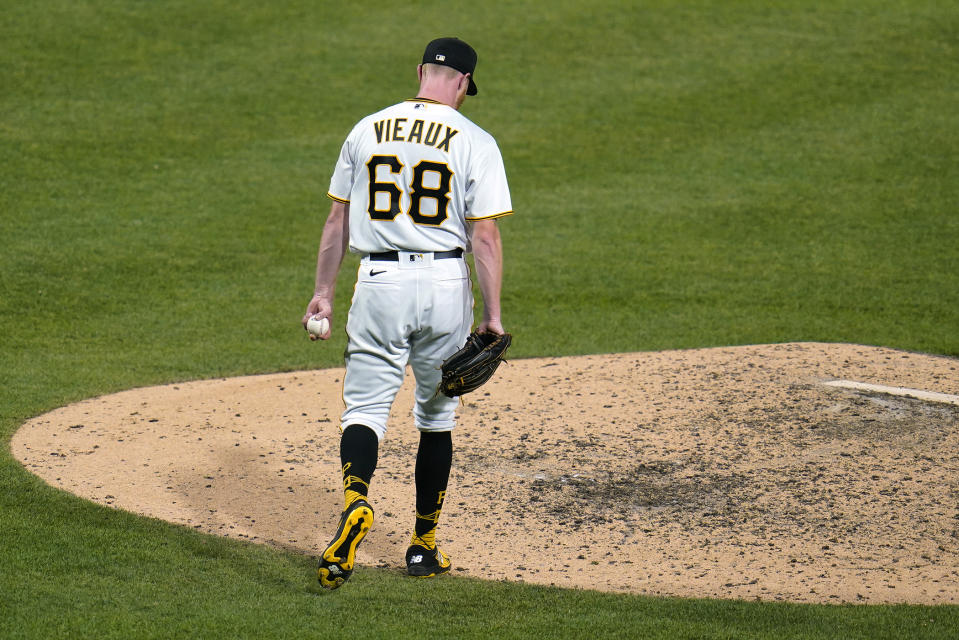 Pittsburgh Pirates relief pitcher Cam Vieaux collects himself after giving up a grand slam to Milwaukee Brewers' Willy Adames during the eighth inning of a baseball game in Pittsburgh, Friday, July 1, 2022. (AP Photo/Gene J. Puskar)