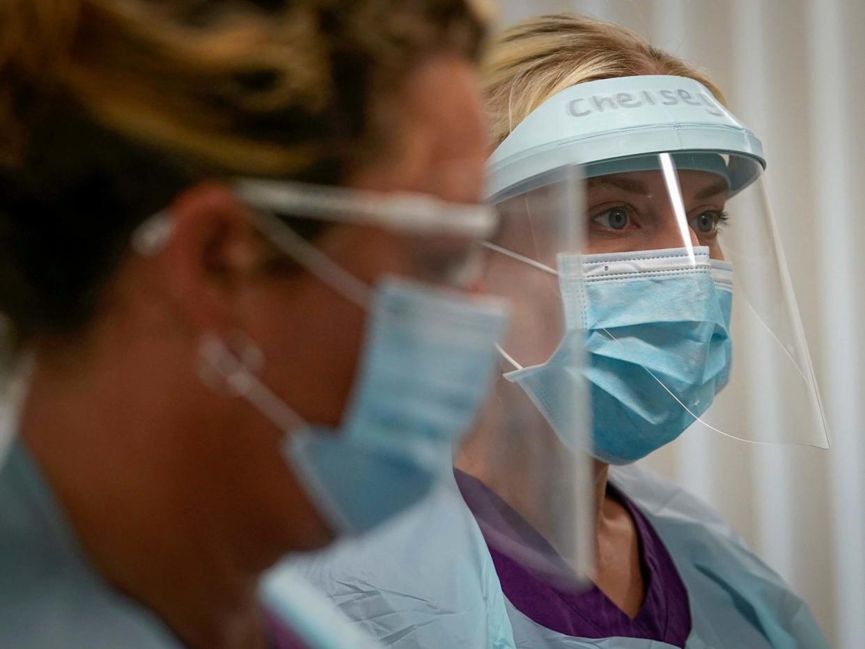 Dental nurses don their PPE before treating a possible Covid-19 positive dental patient at Coed Celyn Hospital, Wrexham: Getty Images