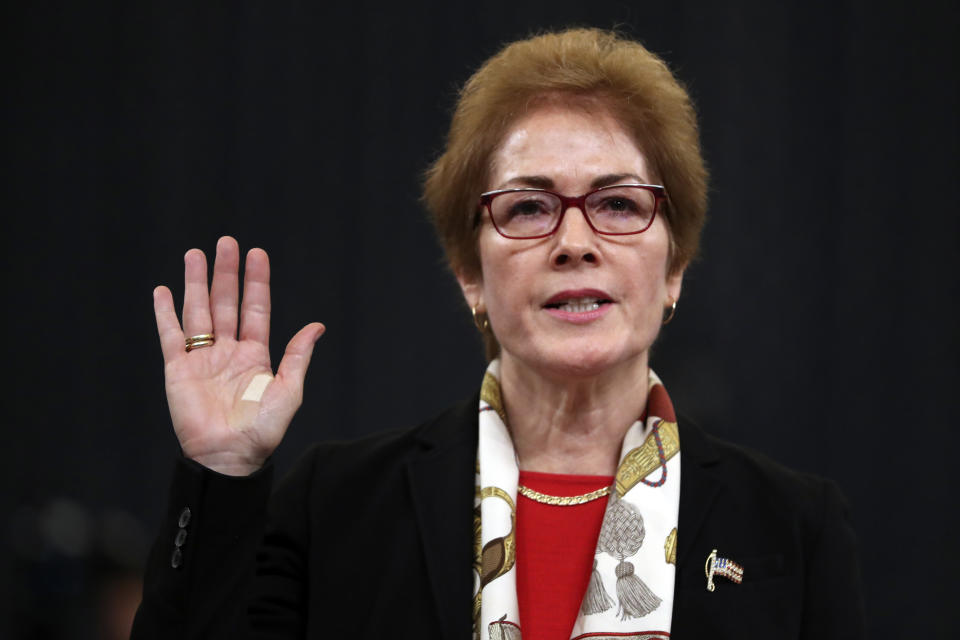 Former U.S. Ambassador to Ukraine Marie Yovanovitch is sworn in to testify to the House Intelligence Committee on Capitol Hill in Washington, Friday, Nov. 15, 2019, during the second public impeachment hearing of President Donald Trump's efforts to tie U.S. aid for Ukraine to investigations of his political opponents. (AP Photo/Andrew Harnik)