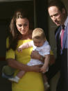 Britain's Prince William, right, his wife Kate, the Duchess of Cambridge, and their son Prince George arrive in Sydney, Australia, Wednesday, April 16, 2014. The Duke and Duchess of Cambridge are on a three-week tour of Australia and New Zealand, the first official trip overseas with their son, Prince George. (AP Photo/Rob Griffith)