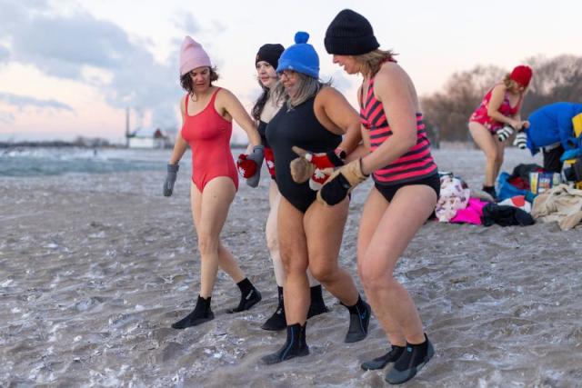 Hundreds plunge into frigid waters of Lake Ontario in Toronto to celebrate  resilience