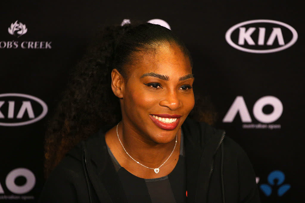 Here’s Serena Williams casually playing tennis with a couple of strangers — while wearing boots