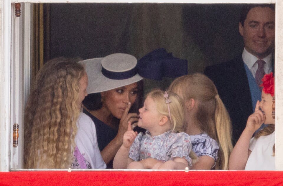 Meghan Markle with Savannah Phillips and Mia Tindall in the  Major General's office overlooking The Trooping of the Colour on Horse Guards Parade.