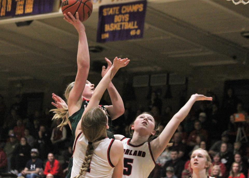 Lincoln's Kloe Froebe drives to the hoop during the first half against Highland in the Class 3A Taylorville girls basketball supersectional at Dolph Stanley Court on Monday.