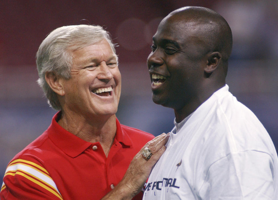 FILE - Kansas City Chiefs coach Dick Vermeil, left, talks with St. Louis Rams running back Marshall Faulk before a preseason NFL football game in St. Louis, Aug. 28, 2003. Vermeil won a Super Bowl with the St. Louis Rams and later coached the Kansas City Chiefs. But Philly is home and he’s going into the Pro Football Hall of Fame as an Eagle. (AP Photo/L.G. Patterson, File)