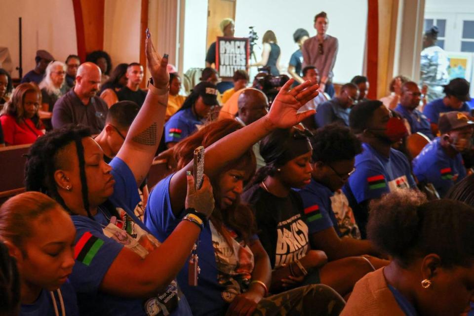 Attendees bow their heads in prayer during the commencement of the event. Mt. Olive Missionary Baptist Church held a voting event entitled “Make Good Trouble by Staying Woke and Staying Strong” where national and local activists gathered to confront the anti-woke agenda by Florida governor and presidential candidate, Ron DeSantis on Thursday, June 22, 2023.