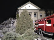 In this photo provided by the Zaporizhzhia region military administration, Ukrainian firefighters work at damaged hospital maternity ward in Vilniansk, Zaporizhzhia region, Ukraine, early Wednesday, Nov. 23, 2022. An overnight rocket attack struck a hospital maternity ward in southern Ukraine, killing a newborn baby, Ukrainian authorities said Wednesday. The baby's mother and a doctor were pulled alive from the rubble. The region's governor said the rockets were Russian. (Zaporizhzhia region military administration via AP)