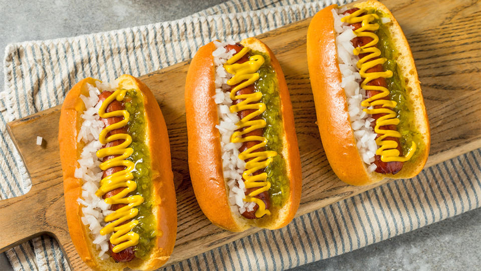 Grilled hot dogs with relish as part of a guide on how to grill hot dogs