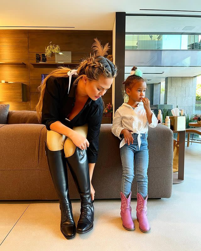 <p>Chrissy Teigen and John Legend's daughter Luna is looking more and more like her famous model mother every day.</p><p>In a cute mother-daughter photo posted to Instagram on January 17 2021, Teigen revealed that the day marked the then-four year old's first time wearing jeans (which also involved an 'epic jean meltdown').</p><p>In the snap, Teigen could be seen wearing cream-coloured riding jodhpurs and black riding boots, while her daughter sported a pair of pink cowboy boots, jeans and a white shirt. The pair looked adorable in their 'twinning' equestrian looks.<br></p><p>The model and mother-of-two opened up about her decision to take up horse-riding on Twitter, noting that it was suggestion from her therapist. </p><p>'My therapist says I need something that I do for just me, as I have absolutely nothing currently lol,' she <a href="https://twitter.com/chrissyteigen/status/1350466325353623554" rel="nofollow noopener" target="_blank" data-ylk="slk:tweeted" class="link ">tweeted</a>. 'Today begins my journey into the horse world. I hope this dude likes me. He’s so handsome and appears lazy, I love.' she wrote alongside a snap uploaded to the social media website of herself at the stables.'</p><p><a href="https://www.instagram.com/p/CKJ1ZskB9mj/?igshid=e7h3ckqrv819" rel="nofollow noopener" target="_blank" data-ylk="slk:See the original post on Instagram" class="link ">See the original post on Instagram</a></p>