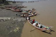 Boats seen on a jetty in Dala township other side of Yangon, February 8, 2011.