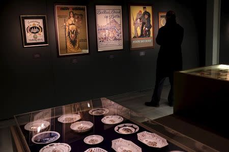 A visitor looks at WWI posters at an exhibition titled "Propaganda and War: The Allied Front During the First World War" in Istanbul March 17, 2015. REUTERS/Murad Sezer
