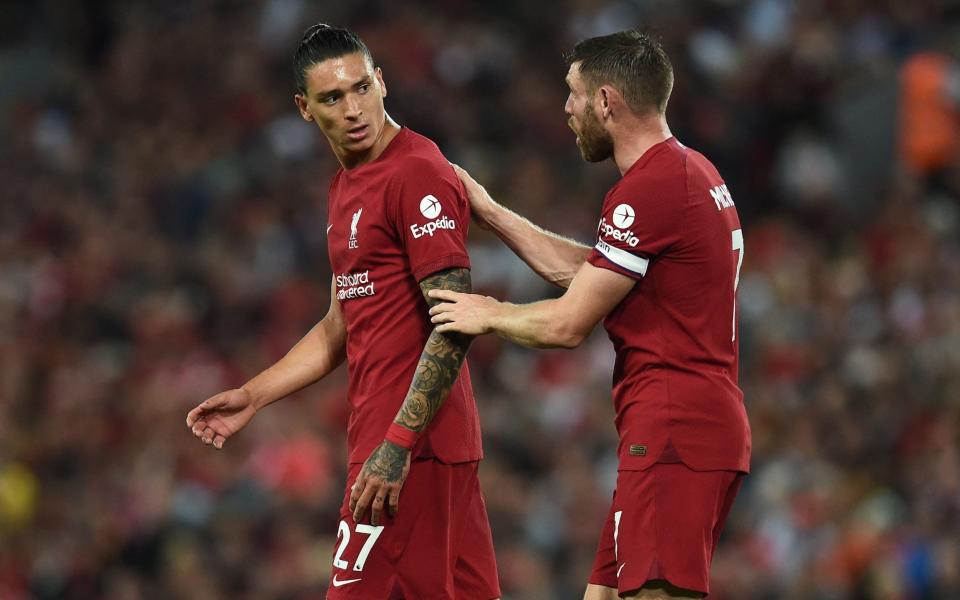 Liverpool's Darwin Nunez leaves the pitch after he is sent off as Liverpool's James Milner - Reuters