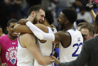 Seton Hall guard Jared Rhoden (14) congratulates forward Sandro Mamukelashvili, left, as Myles Cale (22) joins the celebration after Mamukelashvili hit a shot in the final second of an NCAA college basketball game against Butler on Wednesday, Feb. 19, 2020, in Newark, N.J. Seton Hall won 74-72. (AP Photo/Kathy Willens)