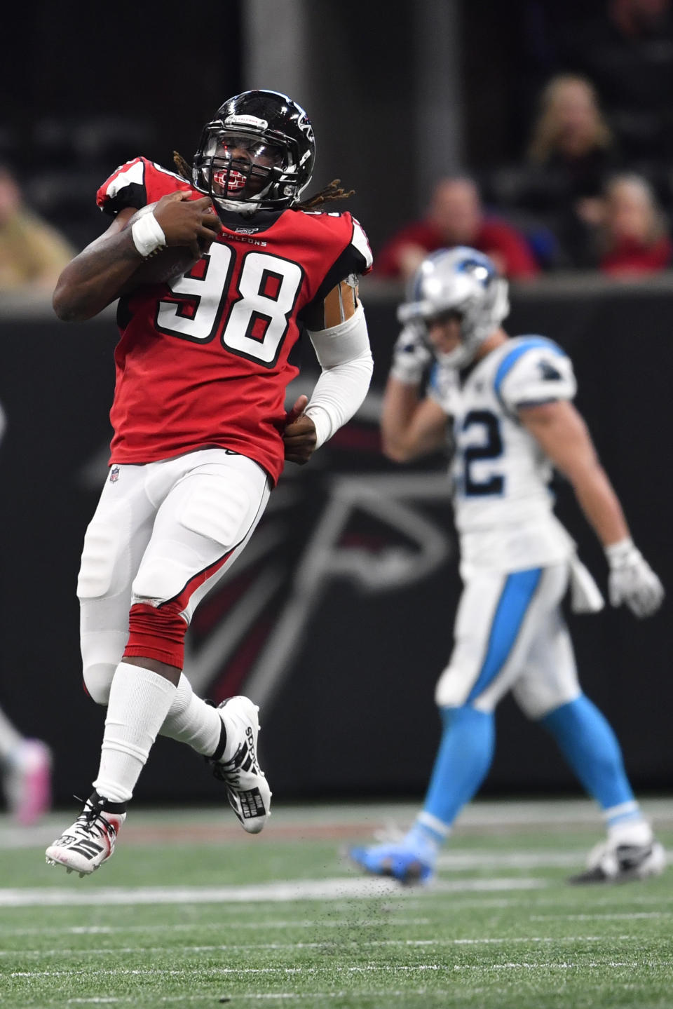 Atlanta Falcons defensive end Takkarist McKinley (98) celebrates on a defensive play against the Carolina Panthers during the second half of an NFL football game, Sunday, Dec. 8, 2019, in Atlanta. (AP Photo/John Amis)