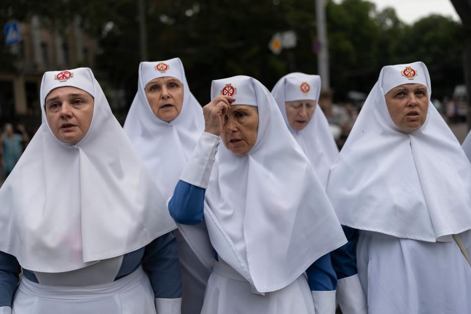 A group of nuns pray outside the Odesa Transfiguration Cathedral in Odesa, Ukraine (AP)