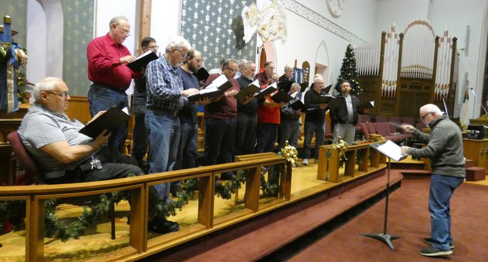 Director George Gibbs, right, leads a rehearsal of United in Harmony on Monday at Good Hope Lutheran Church.