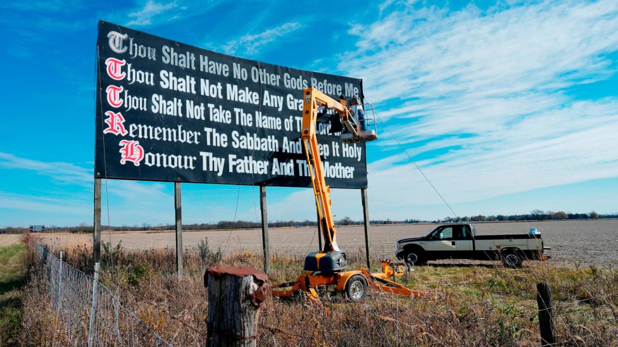 PHOTO: Workers repaint a Ten Commandments billboard off of Interstate 71 on Election Day near Chenoweth, Ohio, Nov. 7, 2023.  (Carolyn Kaster/AP, FILES)