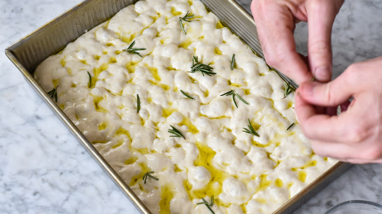 focaccia dough topped with rosemary
