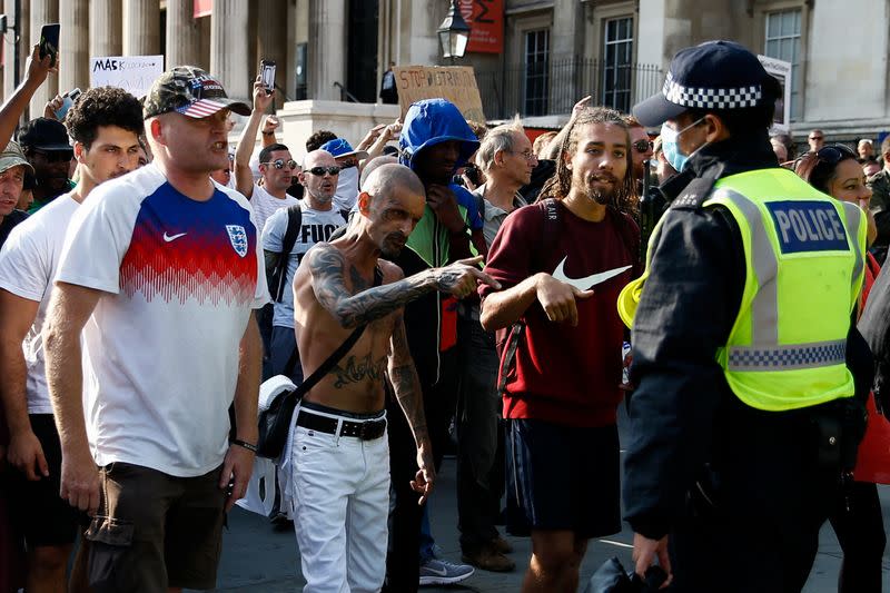 People gather in Trafalgar Square to protest against the lockdown imposed by the government, in London